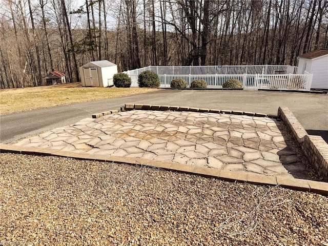 view of patio featuring a shed