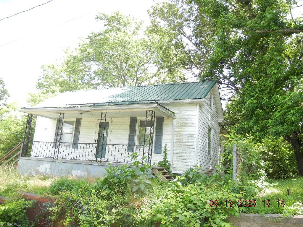 721 Davis St, Eden, NC 27288 - view of front of home with a porch and a metal roof
