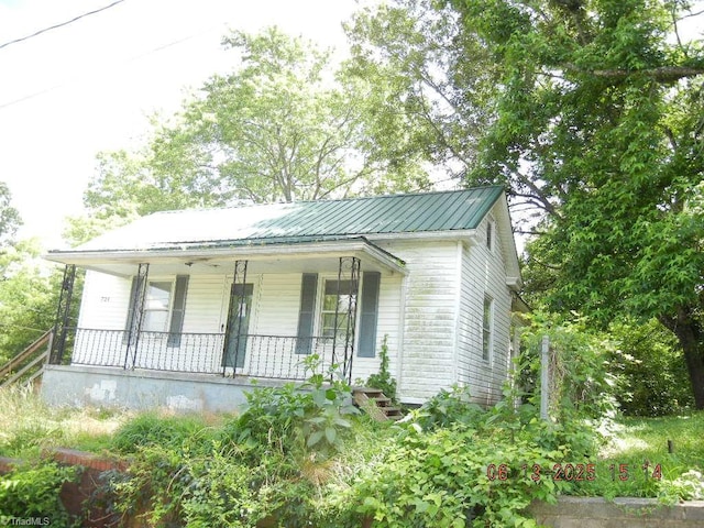 721 Davis St, Eden, NC 27288 - view of front of home with a porch and a metal roof