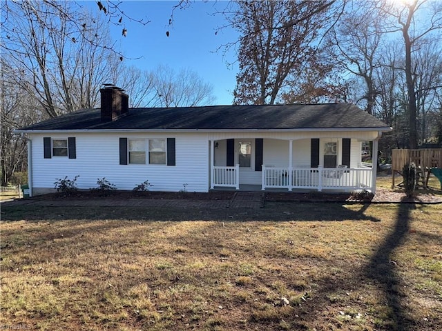 single story home with a front yard and a porch