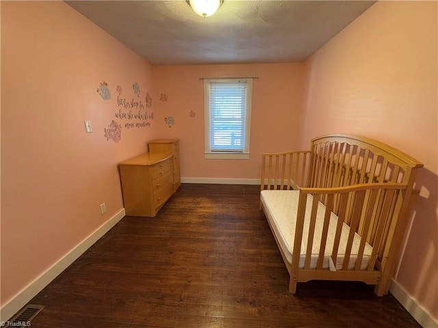 unfurnished bedroom featuring dark hardwood / wood-style floors