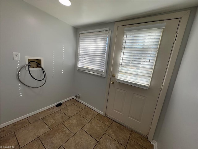 doorway featuring light tile patterned floors