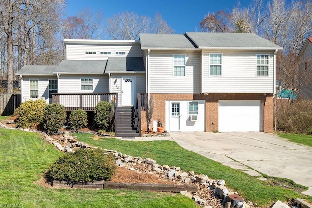 view of front facade featuring driveway, stairway, an attached garage, a front lawn, and brick siding