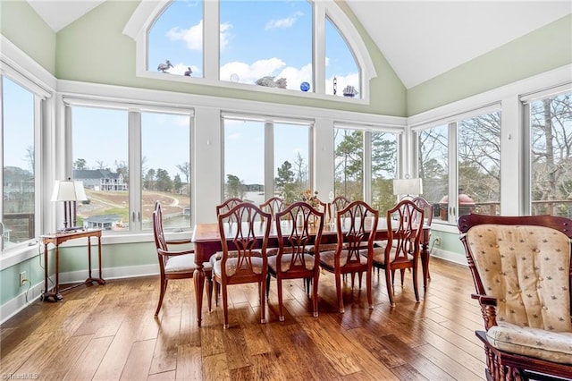 sunroom / solarium featuring vaulted ceiling