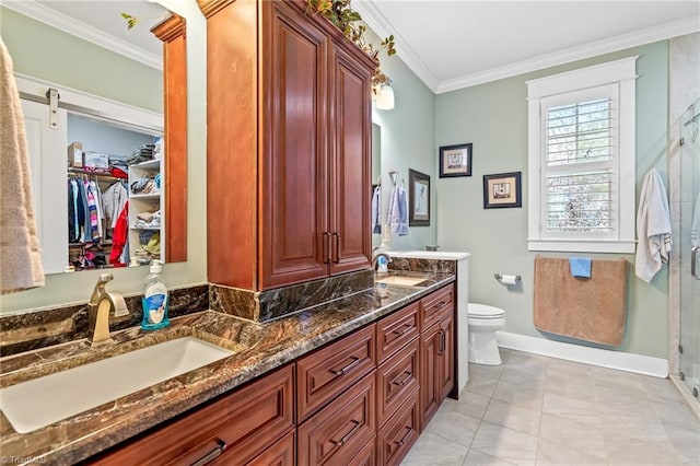 bathroom featuring toilet, an enclosed shower, crown molding, vanity, and tile patterned flooring