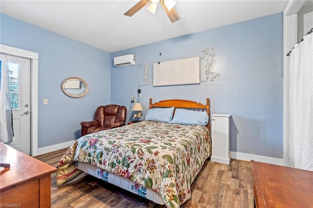 bedroom with ceiling fan, hardwood / wood-style floors, and a wall unit AC