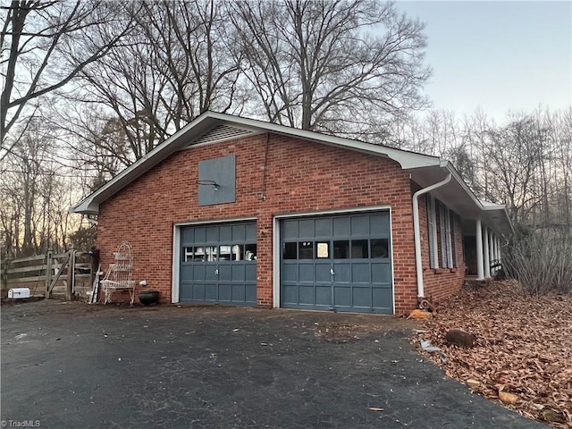 view of side of home with a garage