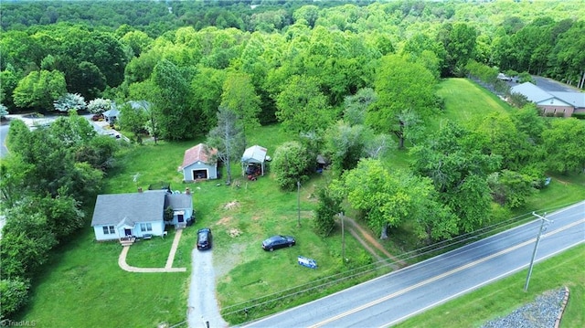 view of property location featuring a heavily wooded area