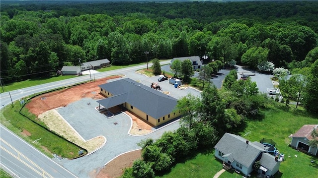 view of subject property featuring a forest