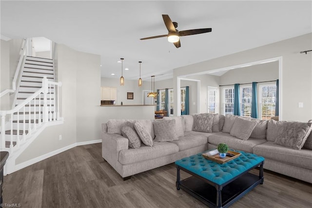 living room featuring wood finished floors, recessed lighting, stairway, baseboards, and ceiling fan