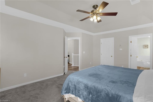 carpeted bedroom with connected bathroom, a ceiling fan, and baseboards