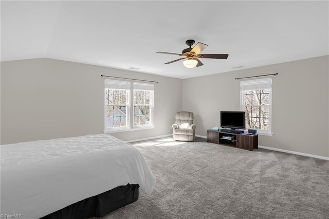 bedroom with baseboards, multiple windows, lofted ceiling, and carpet floors