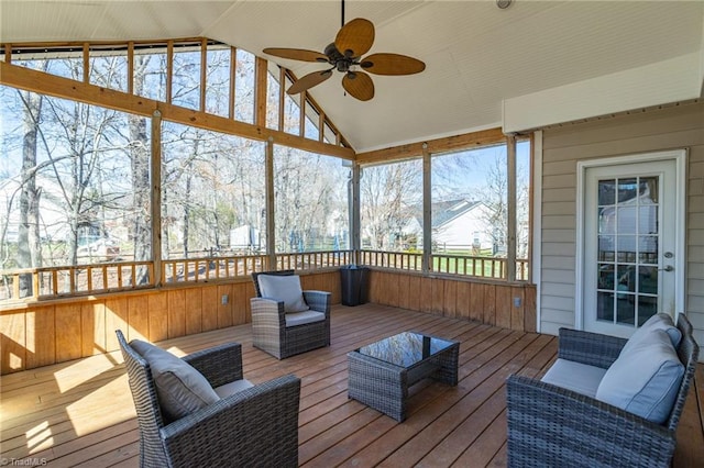 sunroom featuring vaulted ceiling and ceiling fan