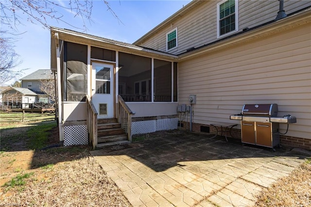 exterior space featuring crawl space, a patio, and a sunroom