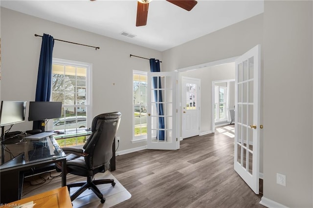 office area featuring visible vents, baseboards, wood finished floors, and french doors