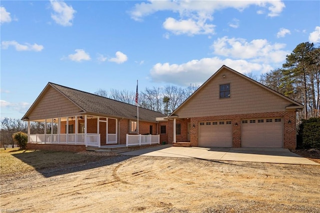 view of front of house with a porch and a garage