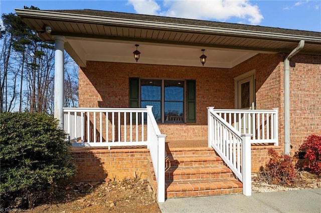 entrance to property featuring a porch