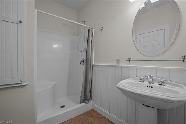 bathroom with sink, tile patterned flooring, and a shower with shower curtain