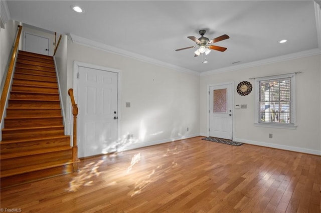 foyer entrance featuring ceiling fan, ornamental molding, and wood-type flooring