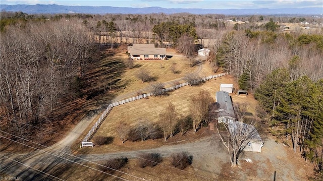 birds eye view of property featuring a mountain view and a rural view