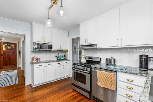 2065 Craig St, Winston-Salem, NC 27103 - kitchen featuring stainless steel appliances, under cabinet range hood, tasteful backsplash, dark wood-type flooring, and white cabinetry