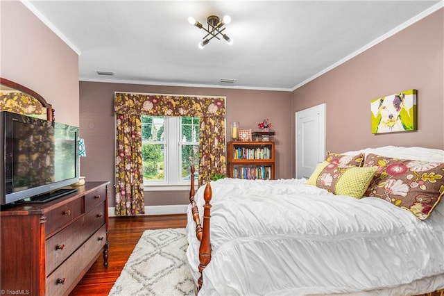 2065 Craig St, Winston-Salem, NC 27103 - bedroom with crown molding and dark wood-style floors