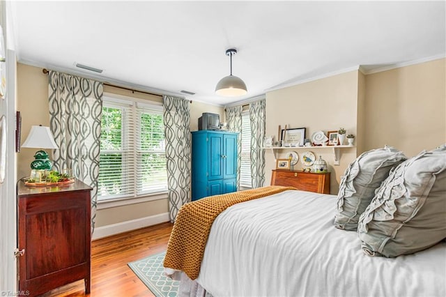 2065 Craig St, Winston-Salem, NC 27103 - bedroom featuring crown molding and wood finished floors