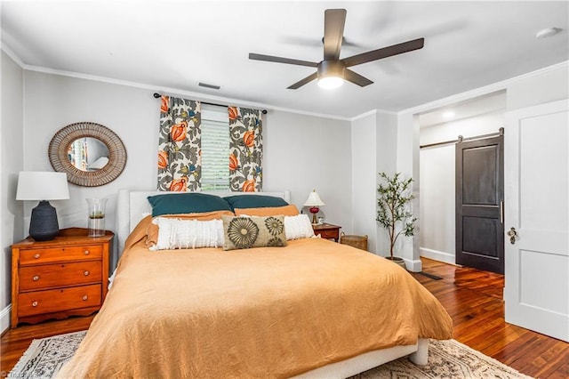 2065 Craig St, Winston-Salem, NC 27103 - bedroom featuring a barn door, wood finished floors, ornamental molding, and ceiling fan