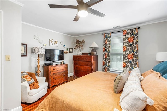 2065 Craig St, Winston-Salem, NC 27103 - bedroom with wood finished floors, crown molding, and a ceiling fan