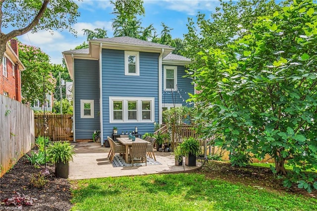 2065 Craig St, Winston-Salem, NC 27103 - rear view of house with a fenced backyard and a patio