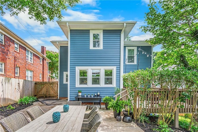 2065 Craig St, Winston-Salem, NC 27103 - back of house featuring outdoor dining area, a patio, a gate, and a deck