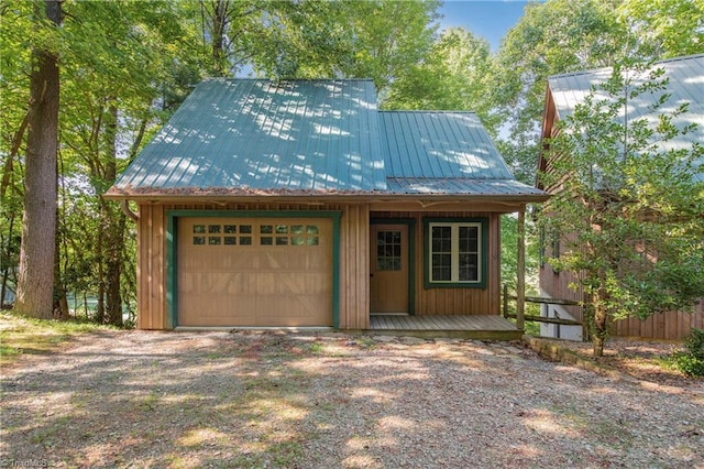 exterior space featuring an outbuilding and a garage