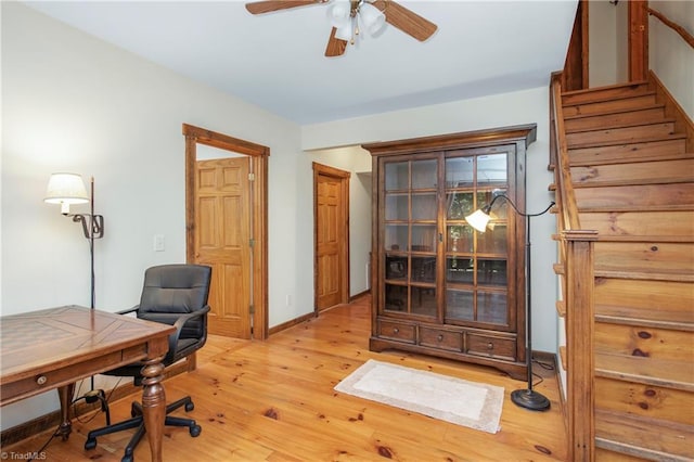 office space featuring light hardwood / wood-style floors and ceiling fan