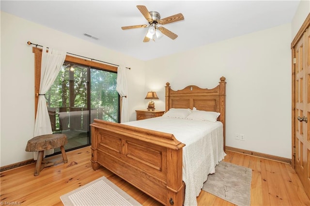 bedroom with light wood-type flooring, ceiling fan, and access to exterior