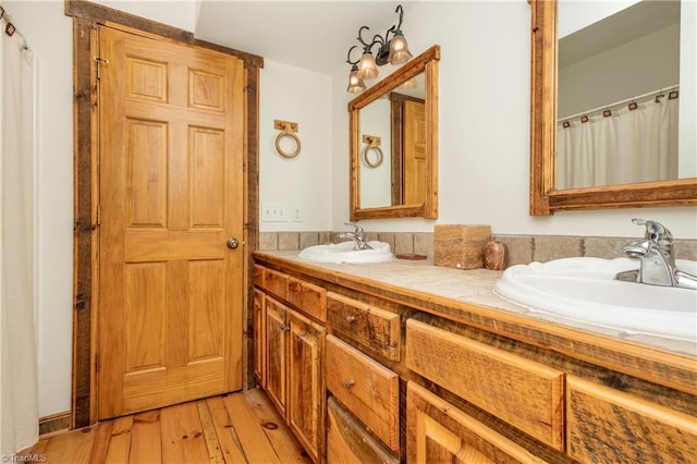 bathroom featuring vanity and hardwood / wood-style floors