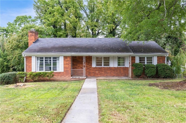 ranch-style home with a front yard and a porch