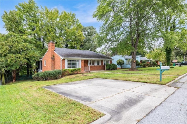 ranch-style house with a front lawn