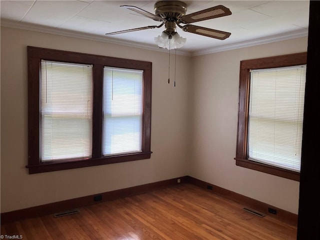 2096 Fancy Gap Rd, Mount Airy, NC 27030 - spare room featuring crown molding, baseboards, wood finished floors, and ceiling fan