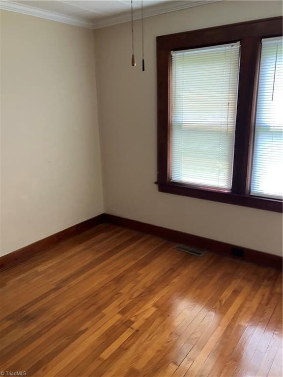 2096 Fancy Gap Rd, Mount Airy, NC 27030 - unfurnished room with ornamental molding, wood finished floors, and baseboards