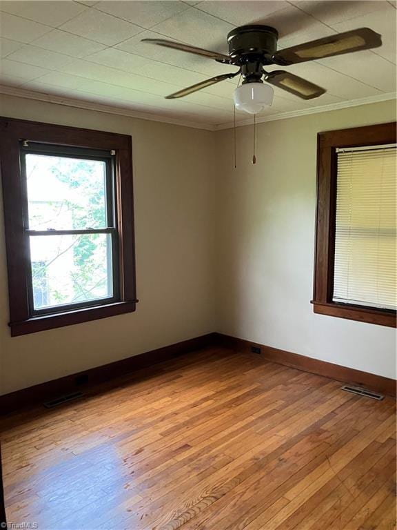 2096 Fancy Gap Rd, Mount Airy, NC 27030 - unfurnished room with light wood-style floors, crown molding, baseboards, and a ceiling fan
