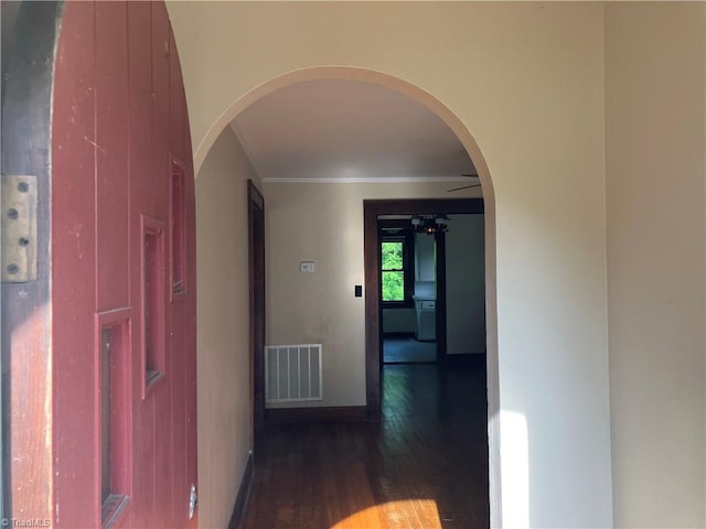 2096 Fancy Gap Rd, Mount Airy, NC 27030 - hall featuring dark wood finished floors, ornamental molding, arched walkways, and baseboards