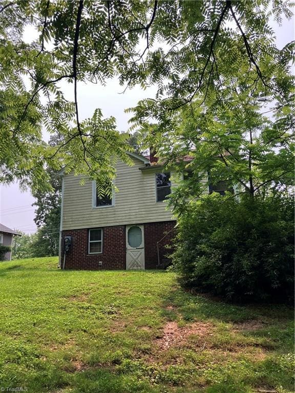 2096 Fancy Gap Rd, Mount Airy, NC 27030 - view of side of home with brick siding and a lawn