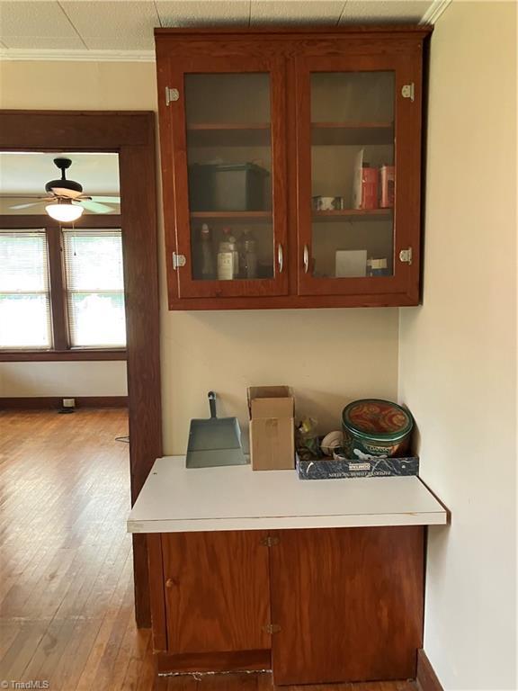 2096 Fancy Gap Rd, Mount Airy, NC 27030 - detailed view of a ceiling fan, wood finished floors, ornamental molding, and baseboards