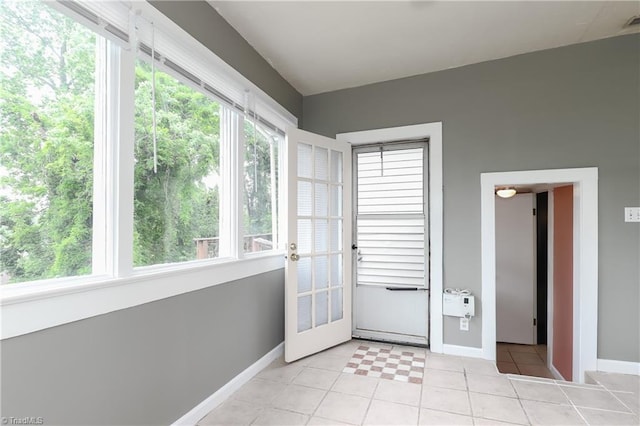 1025 W End Blvd, Winston-Salem, NC 27101 - doorway to outside featuring baseboards and light tile patterned floors