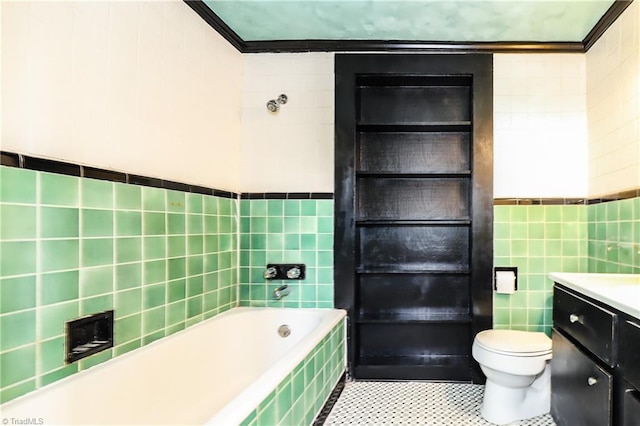 1025 W End Blvd, Winston-Salem, NC 27101 - bathroom with tile walls, vanity, tiled tub, toilet, and ornamental molding