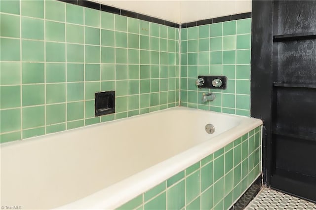 1025 W End Blvd, Winston-Salem, NC 27101 - bathroom featuring a washtub and tile walls