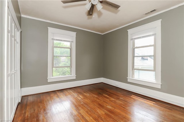 1025 W End Blvd, Winston-Salem, NC 27101 - spare room with hardwood / wood-style flooring, ceiling fan, baseboards, visible vents, and crown molding
