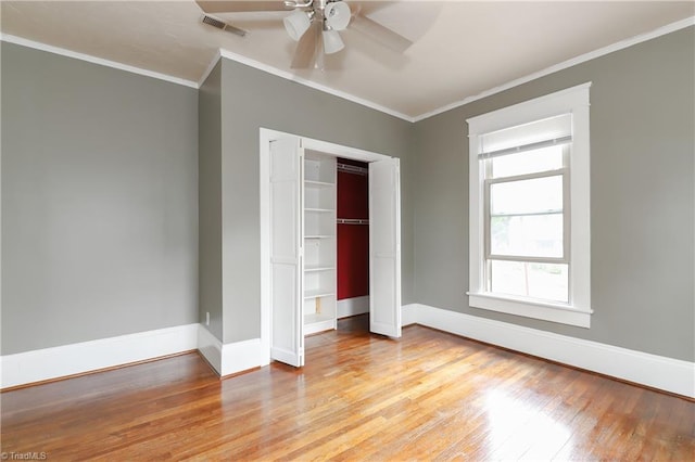 1025 W End Blvd, Winston-Salem, NC 27101 - unfurnished bedroom featuring crown molding, visible vents, baseboards, a closet, and light wood-type flooring