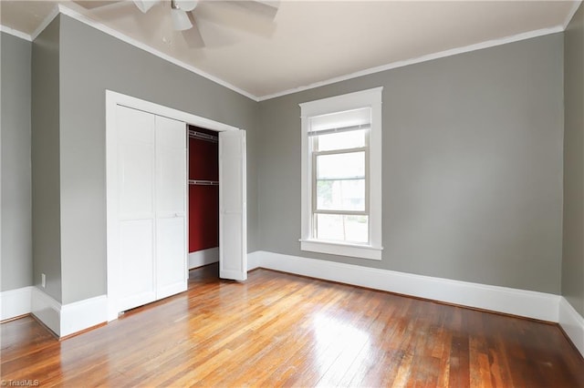 1025 W End Blvd, Winston-Salem, NC 27101 - unfurnished bedroom featuring baseboards, ornamental molding, light wood-style floors, and a closet