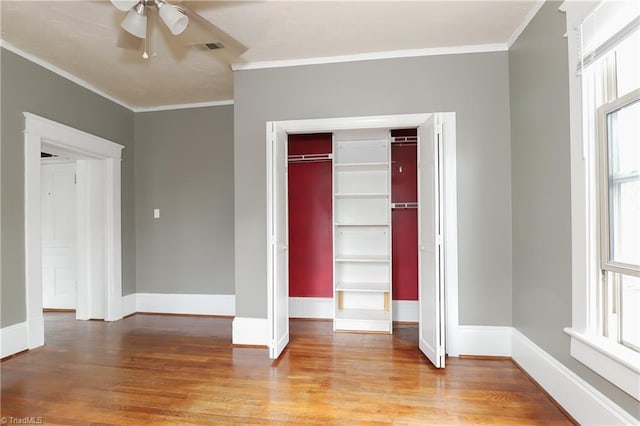 1025 W End Blvd, Winston-Salem, NC 27101 - unfurnished bedroom with crown molding, multiple windows, and light wood-style flooring